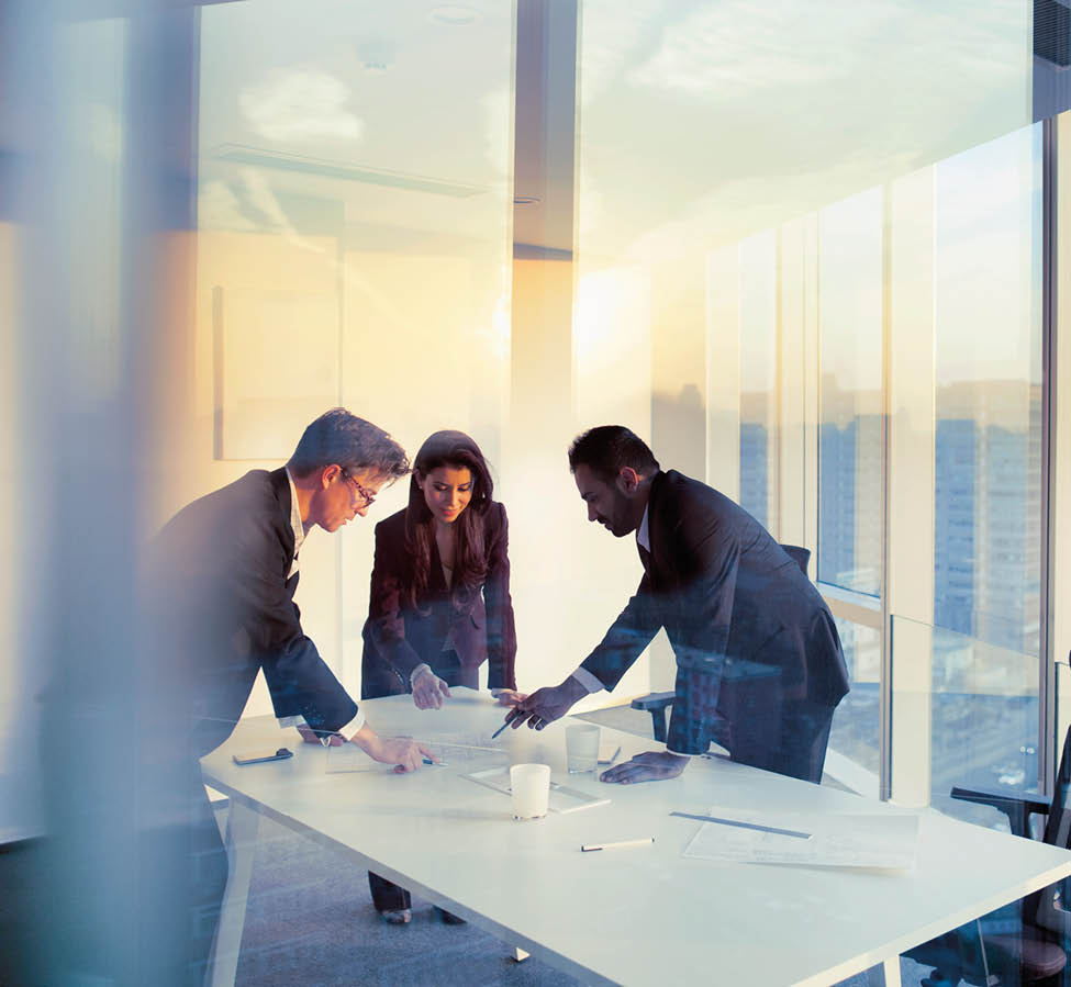 Adult senior diverse multi-ethnic Caucasian Hispanic Middle Eastern CEO executive team business people together in conference meeting room in contemporary modern office bright sunny daylight sunset dusk talking discussing planning organizing strategy well dressed suit and tie teamwork cooperation diversity multi-ethnic problems solutions unity cityscape downtown urban new beginnings breaking new ground dreamlike decisions choices the way forward diversity